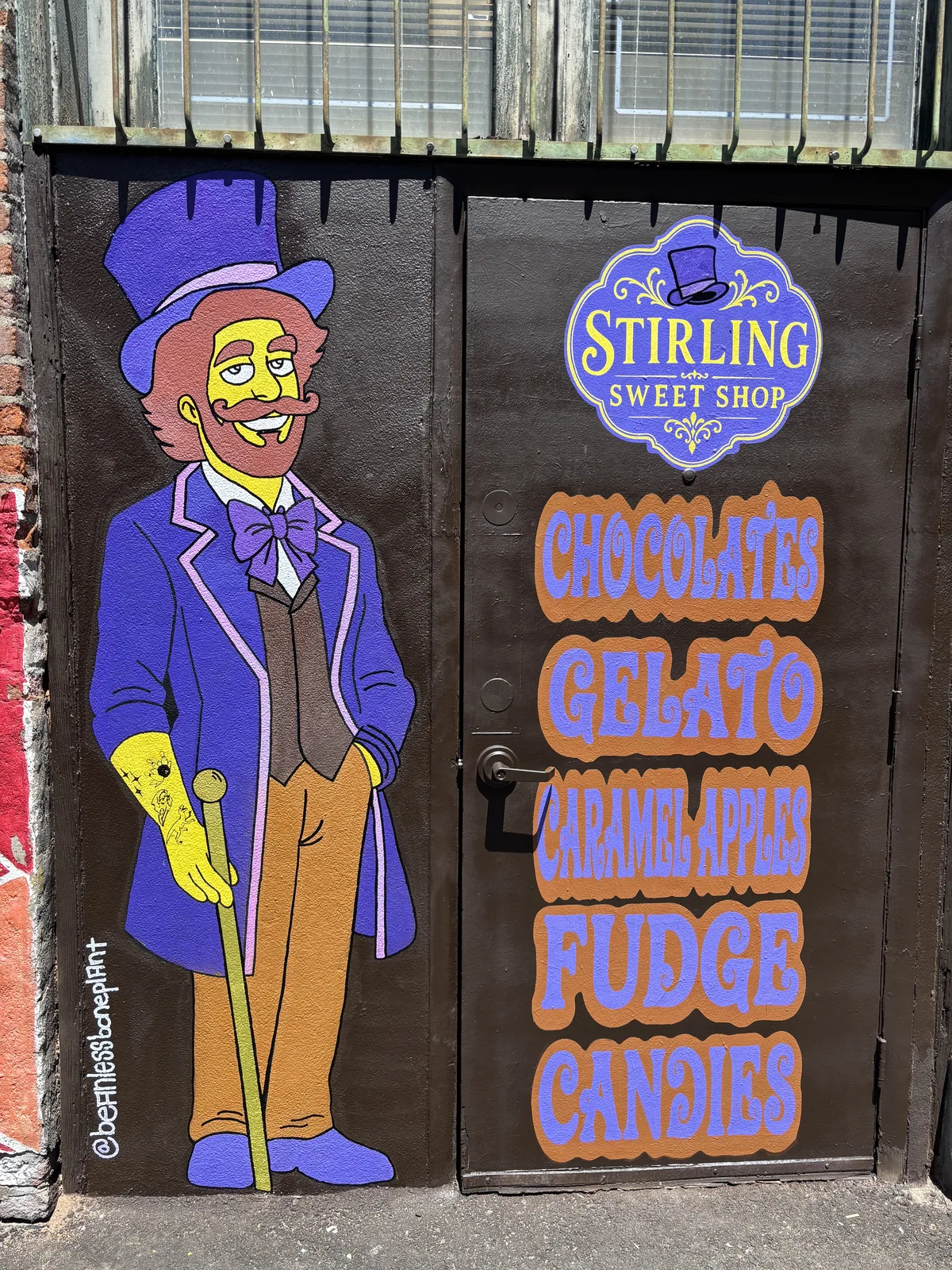 Mr. Stirling painted on the shop’s back door in Freak Alley